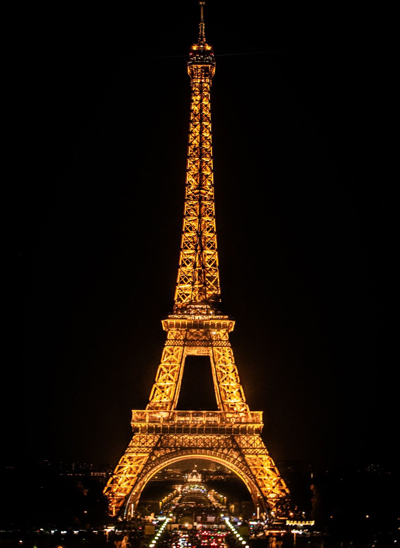 The Eiffel Tower illuminated at night in Paris.